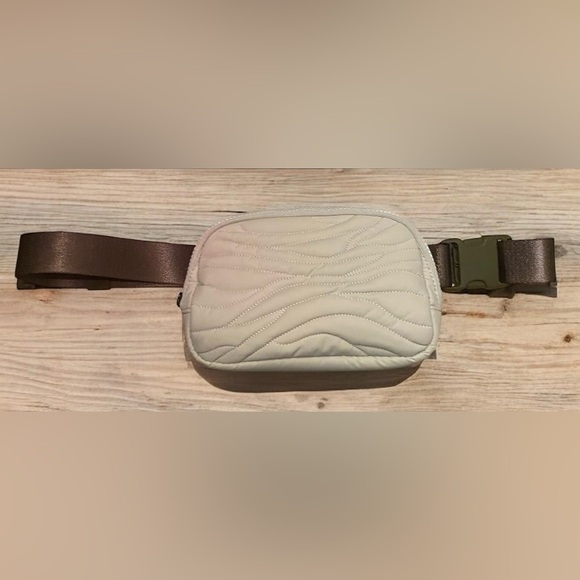 Lululemon Handbags - Lululemon Team Canada Olympic light beige/cream belt bag.